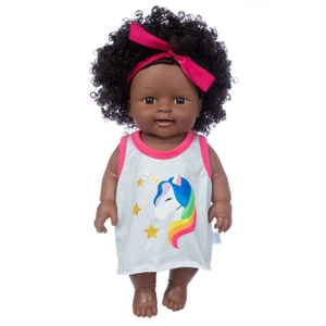 Close-up of a 12-inch African baby doll with curly black hair and pink bow headband