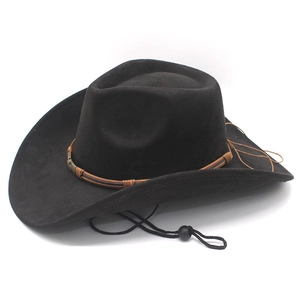 Detail of black faux suede cowboy hat with brown braided band and metal decorative buckle
