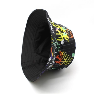 Detail view of cotton bucket hat with street style graffiti print and black lining