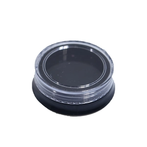 Clear round nail art storage container with a black base and textured screw cap