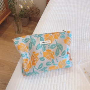 Detailed view of yellow floral jacquard fabric with a simple wish textile label