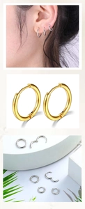 Vertical view of minimalist gold and silver titanium steel hoop earrings for multi-piercing