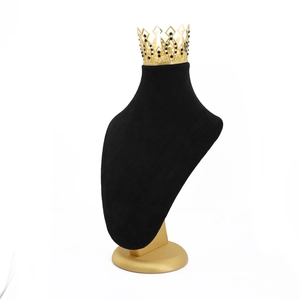 Black velvet jewelry bust stand with golden crown necklace display for shop showcase