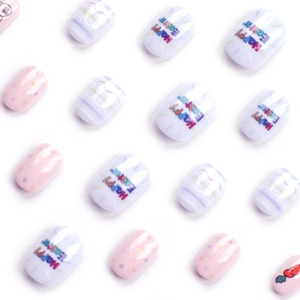 Short round press-on nails with Easter bunny motifs and Happy Easter lettering