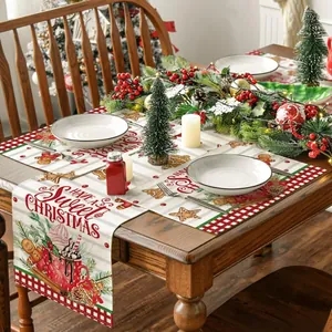 Close-up of Christmas table runner and placemats with gingerbread man and red plaid design