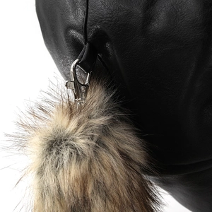 Detail of premium black leather cap with silver metal buckle and soft brown fur lining