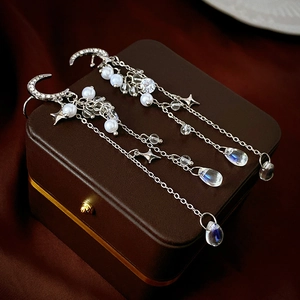 Elegant silver moon and star earrings with long tassels, rhinestones and pearls