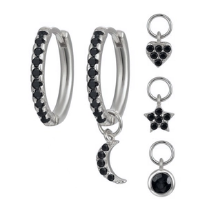 Detail of S925 silver earring set with black stones and moon star heart charms
