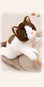 Detailed view of a fluffy cat plush with blue eyes and soft brown and white faux fur