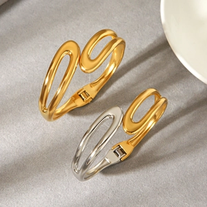 Elegant two-tone stainless steel open bangle with minimalist gold hollow curved design