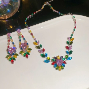 Macro shot of silver jewelry set with colorful heart and leaf shaped cubic zirconia stones