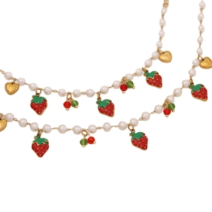 Sweet strawberry and gold heart charm necklace with white faux pearls on a gold chain