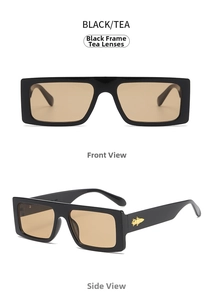 Detail view of retro rectangle sunglasses in black frame with gold rocket metal decor