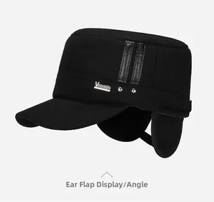 Detailed view of the fold-down earflaps and metal logo on this winter wool flat cap