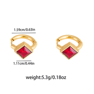 Detail showing dimensions of gold huggie earrings with a square red crystal stone