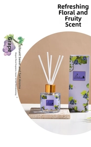 Close-up of Grape Reed Diffuser set with glass bottle and white fiber sticks