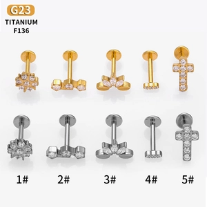 G23 titanium piercing studs set with cubic zirconia in gold and silver finishes