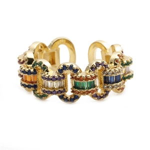 Close-up of golden chain link ring with colorful zircon stones and micro-pave crystals