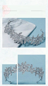 Detailed view of silver bridal crown with intricate floral crystal and rhinestone patterns