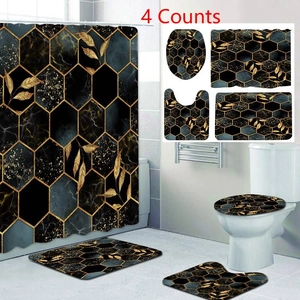 Dettaglio del set da bagno da 4 pezzi con motivo in marmo nero e foglie dorate