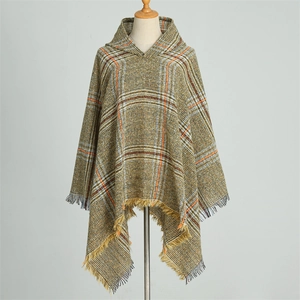 Plaid hooded poncho with tassels in warm brown and orange tones for winter fashion