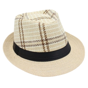 Detail of checkered woven fedora hat with a black satin ribbon on plain white background