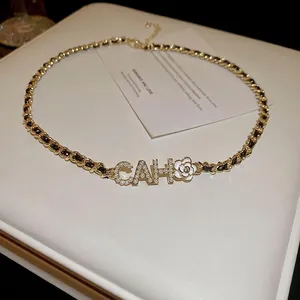 Elegant gold plated necklace with pearl CAH pendant and white camellia flower