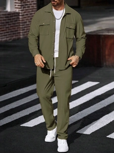 Detail of olive green corduroy texture on lapel jacket and drawstring trousers