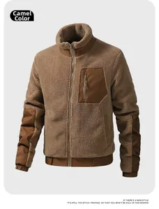 Detail of camel sherpa fleece jacket featuring contrast zipper pocket and elastic cuffs