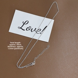 Detail of a 1.5mm platinum plated chain with lobster clasp and adjustable extension link
