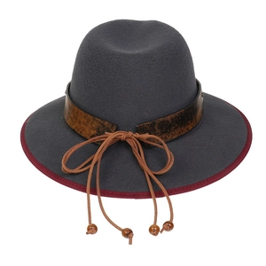 Detail view of a grey fedora hat featuring red piping and brown leather strap with wooden beads