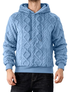 Detail of light blue fleece hoodie with textured diamond pattern and drawstring hood