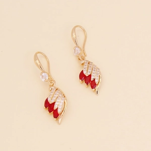 Fashionable gold feather necklace with vibrant red marquise gems and sparkling crystals