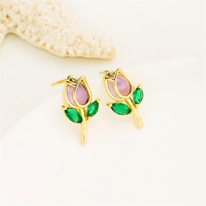 Close-up of golden tulip stud earrings with purple bud stones and green leaf gems