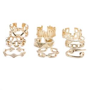 9-piece gold ring set featuring chain patterns, cut-outs, and a smiley face design