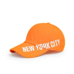 Detailed white 3D New York City embroidery on a vibrant orange cotton baseball cap
