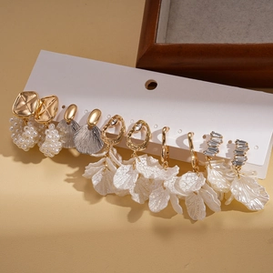 Elegant ten-piece earring set with pearls and rhinestones on white display card