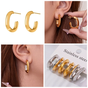 Detailed views of U-shaped stainless steel earrings in gold and silver finish