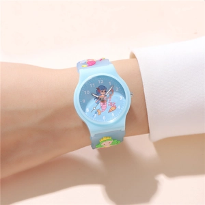 Close-up of blue kids watch with cartoon mermaid dial and 3D silicone strap patterns