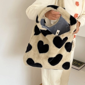 Winter heart pattern plush tote bag in cream white with soft faux fur texture