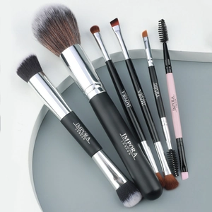 Close-up of 7-piece makeup brush set featuring soft synthetic bristles and matte handles