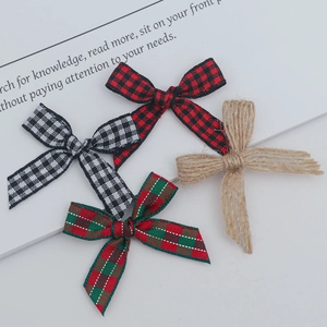 Close-up of assorted plaid and burlap handmade bows for DIY gift wrapping and crafts