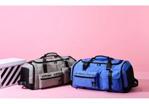 Front view of grey and blue large sports gym bags with waterproof fabric and carry handles