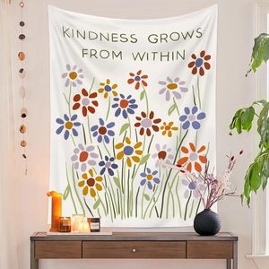 Floral wall tapestry with Kindness Grows From Within quote in a cozy room setting