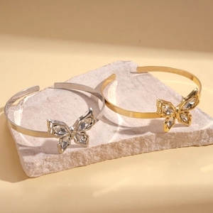 Polished metallic butterfly open arm cuff bracelets in gold and silver with rhinestones