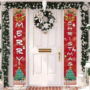 Red Merry Christmas door banners with festive illustrations hanging on a white front door