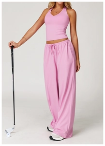 Detail view of pink high-waisted wide-leg sweatpants with drawstring and soft brushed texture