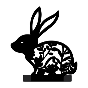 Detailed view of a black acrylic Easter bunny figurine with intricate floral cutout patterns