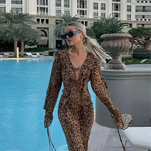 Detail of the plunging V-neckline and ruffle trim on this leopard print chiffon maxi dress