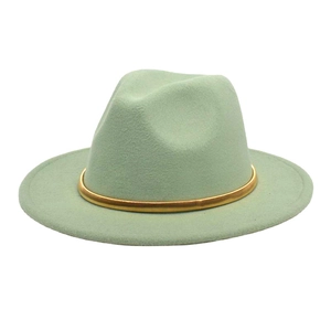 Close-up of mint green wool felt fedora hat featuring a slim gold metallic band decoration